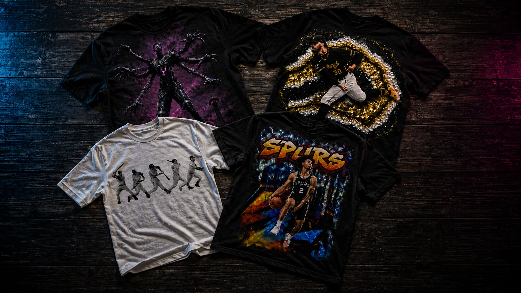 The Carded apparel: graphic sports tees laid out on a dark wood floor
